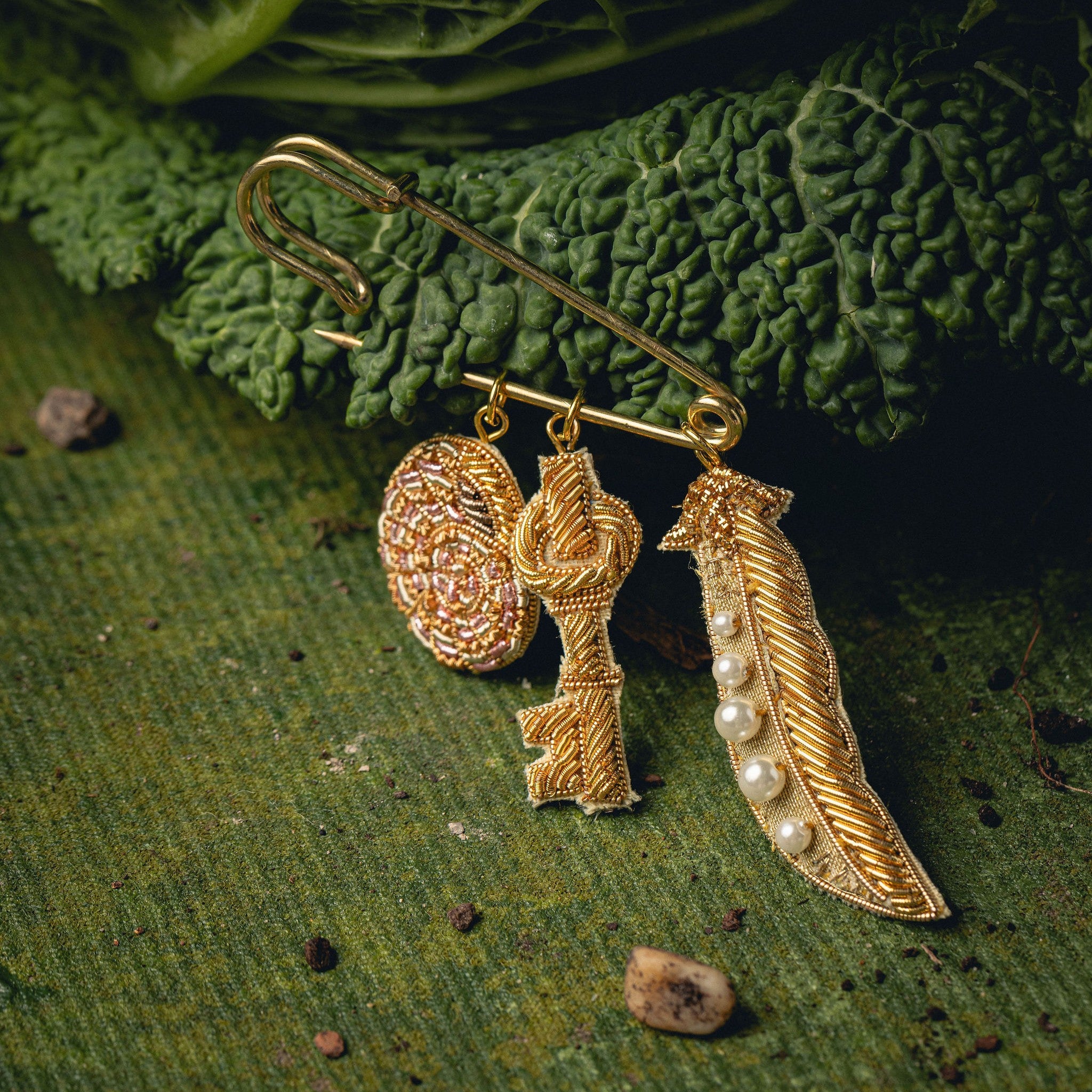 Garden Charm Brooch - Hand Embroidered charm brooch photographed on a cabbage leaf