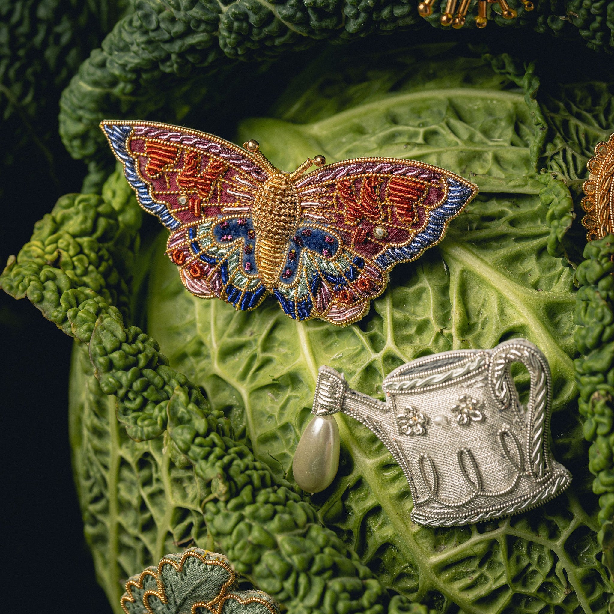 How Does Your Garden Grow? Collection of Hand Embroidered Jewellery - Butterfly and watering can brooches on a green cabbage leaf