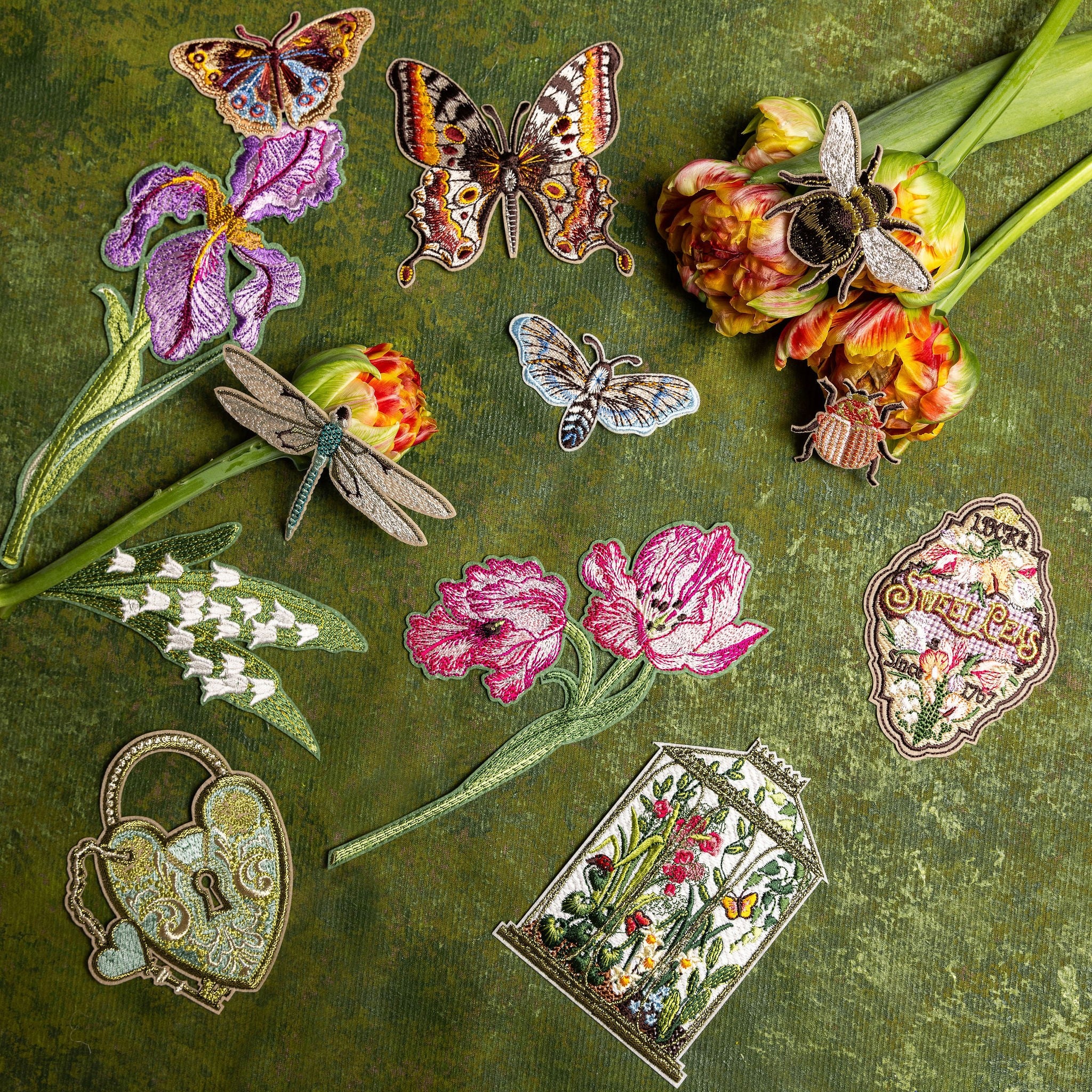 How Does our Garden Grow Collection - Collection of embroidered patches on a green background