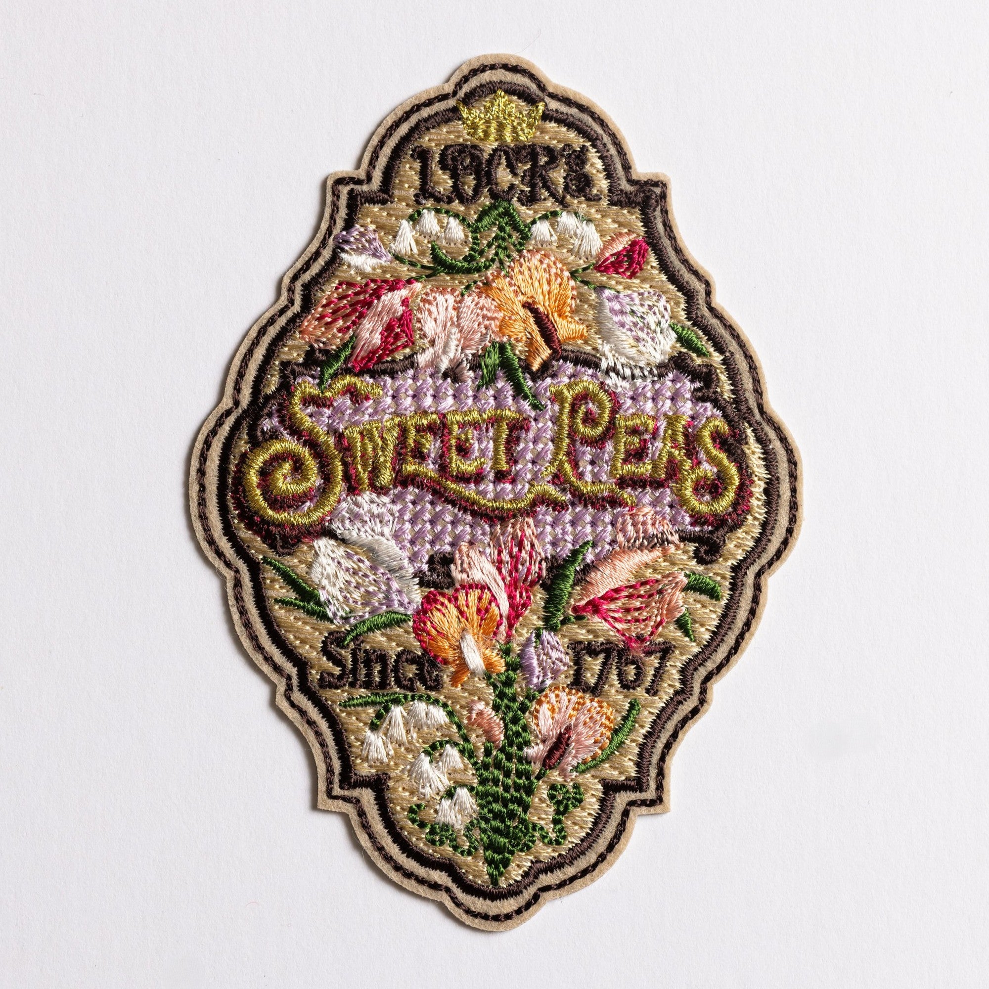 Sweet Pea Seeds Patch - Decorative patch with floral design and text on a white background