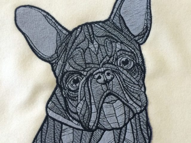 A Charm Dog, Embroidered Sample Hand & Lock