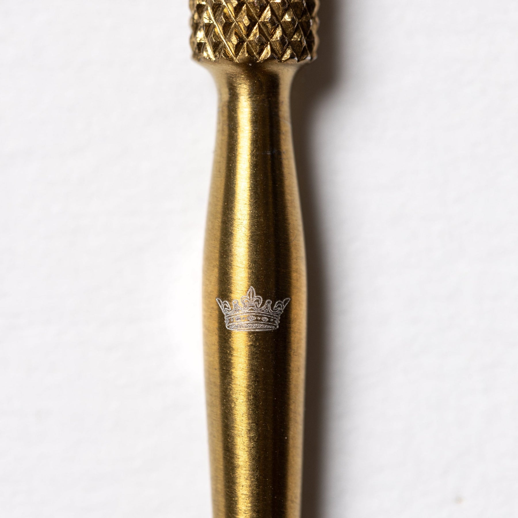 Gold embroidery pricker with crown detail 