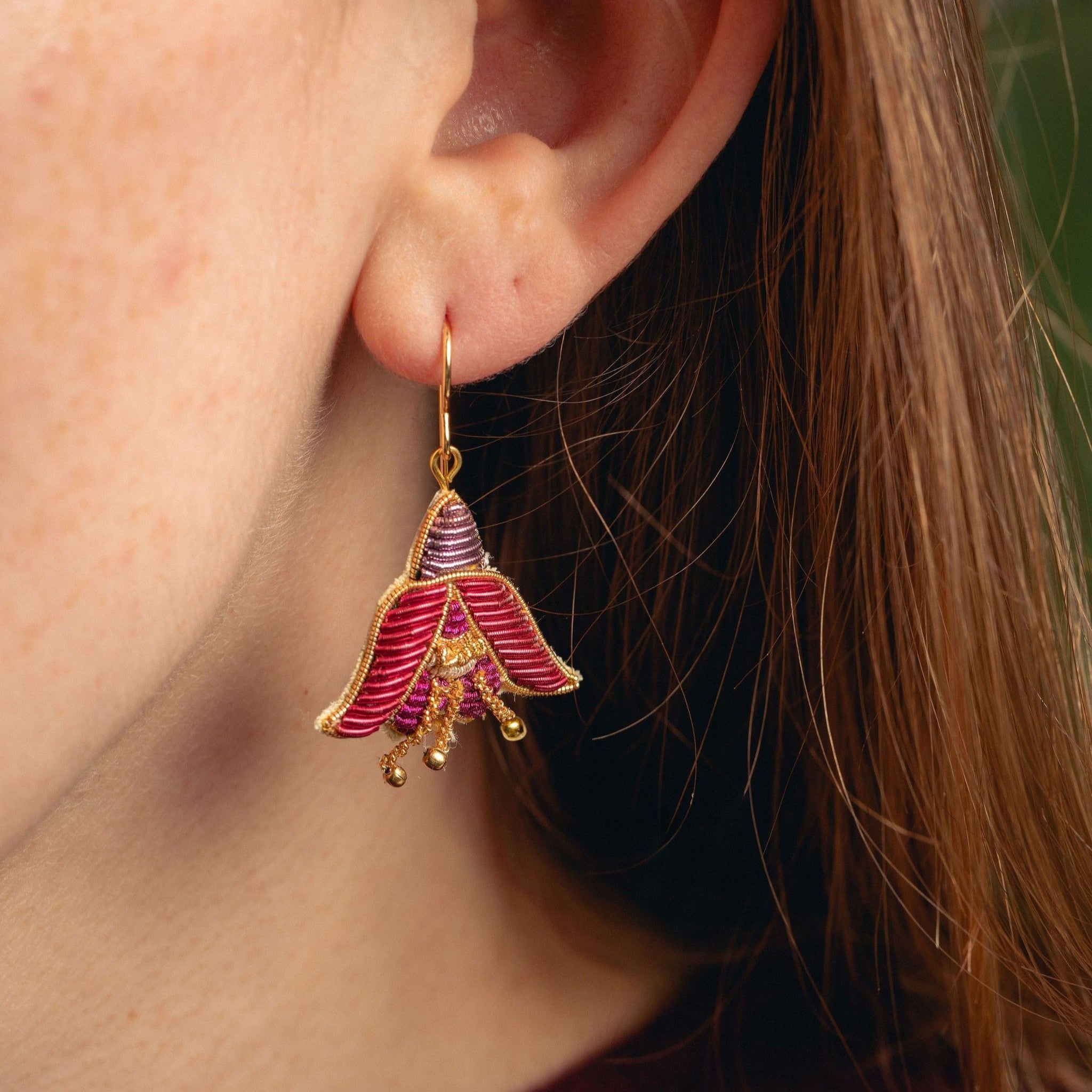 Fuchsia Earrings - Hand Embroidered flower earrings close up being worn