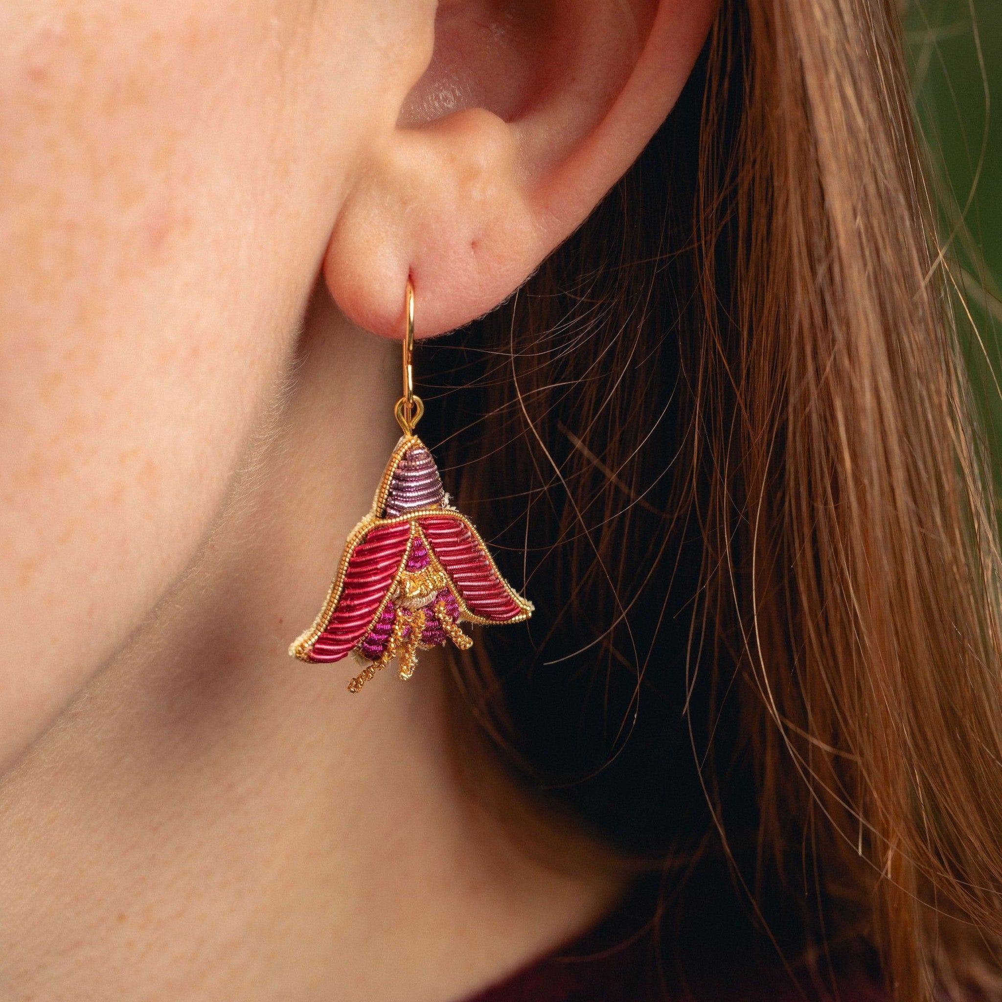 Fuchsia Earrings - Hand Embroidered flower earrings close up being worn
