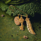 Garden Charm Brooch - Hand Embroidered charm brooch photographed on a cabbage leaf