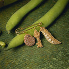 Garden Charm Brooch - Hand Embroidered  charm brooch photographed on runner beans