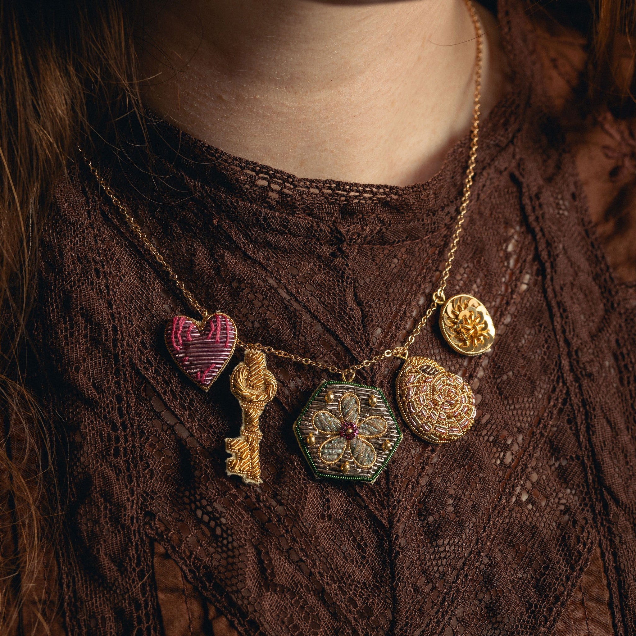 Garden Charm Necklace - Hand Embroidered charm necklace on a brown blouse