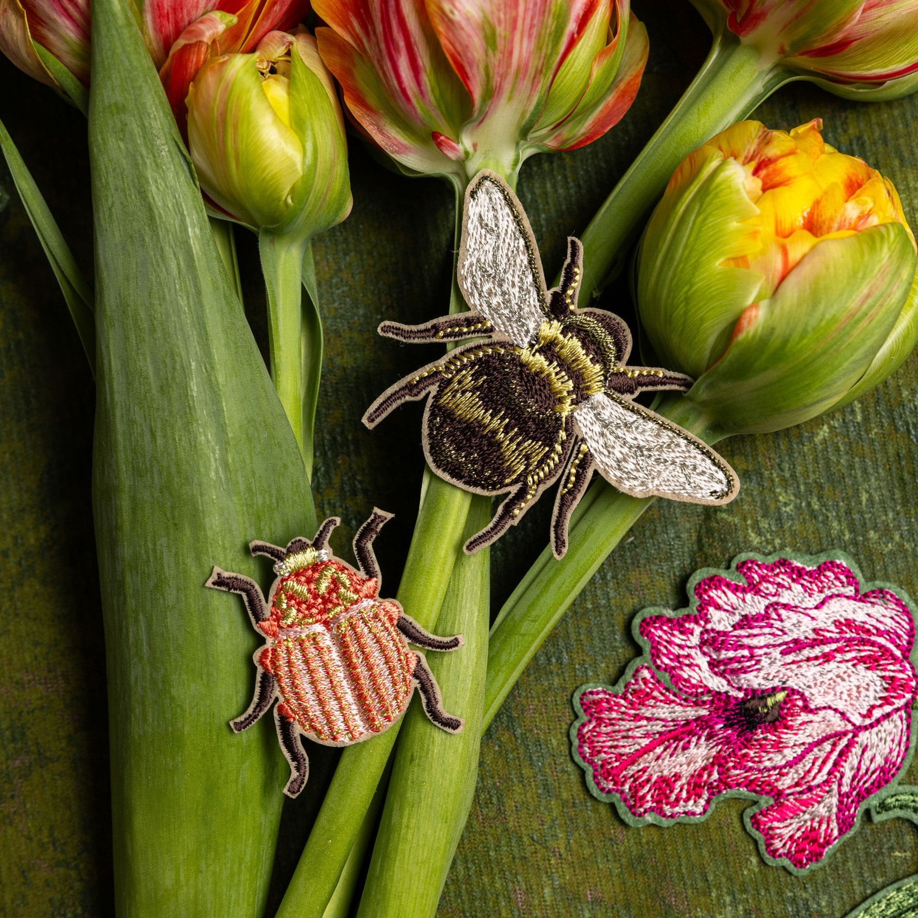 Garden Insects Embroidered Patch Set - Embroidered patches of a bee and beetle displayed on tulip stems