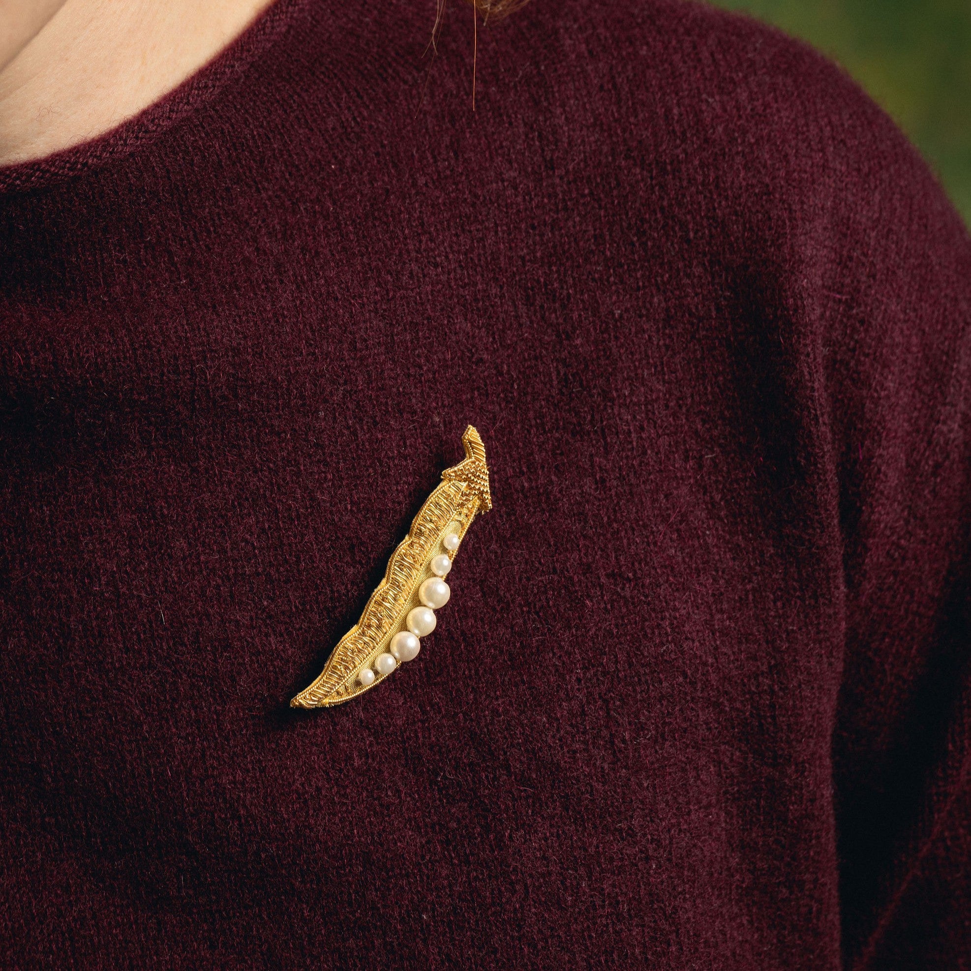 Golden Pea Brooch - Hand Embroidered brooch on a maroon jumper