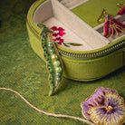 Green Pea Brooch - Hand Embroidered brooch with a green jewellery box on a green background
