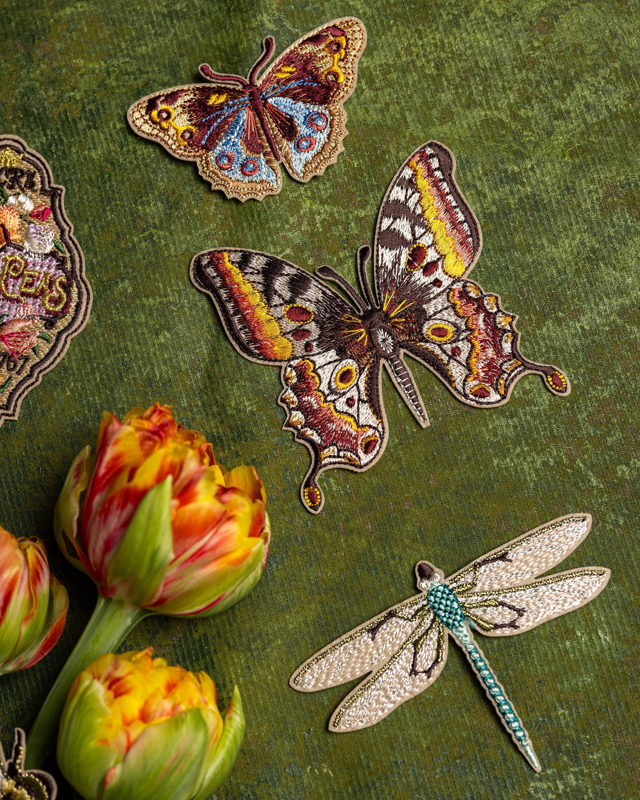 How Does our Garden Grow Collection - Butterflies and Dragonfly Embroidered Patches on a green background