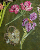 How Does our Garden Grow Collection - Embroidered patches of pink flowers and a heart-shaped lock on a green background