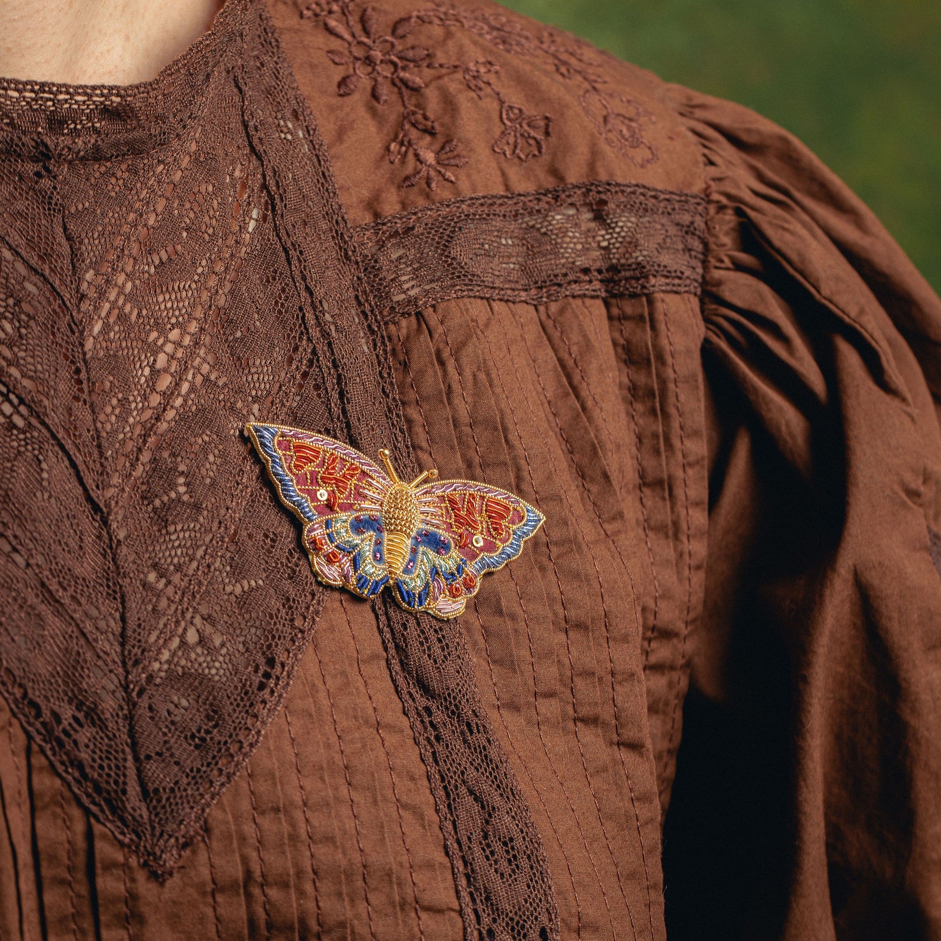 Kaleidoscope Butterfly Brooch - Hand Embroidered butterfly brooch on a brown blouse