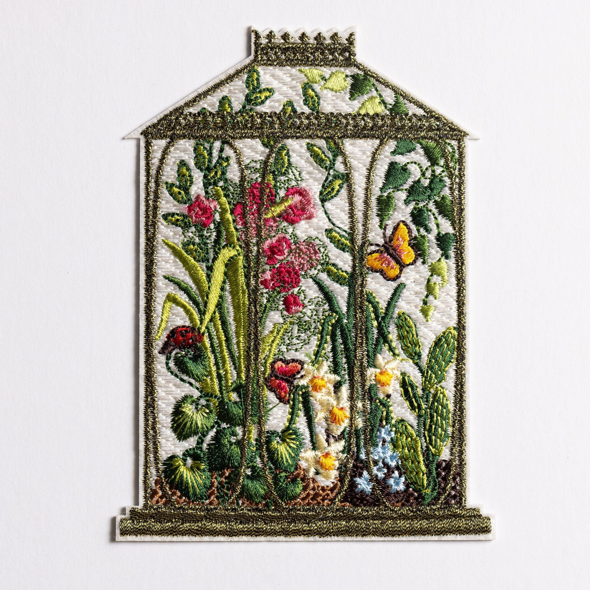 Locks Greenhouse Embroidered Patch - Embroidered artwork of a botanical greenhouse with flowers and plants inside.