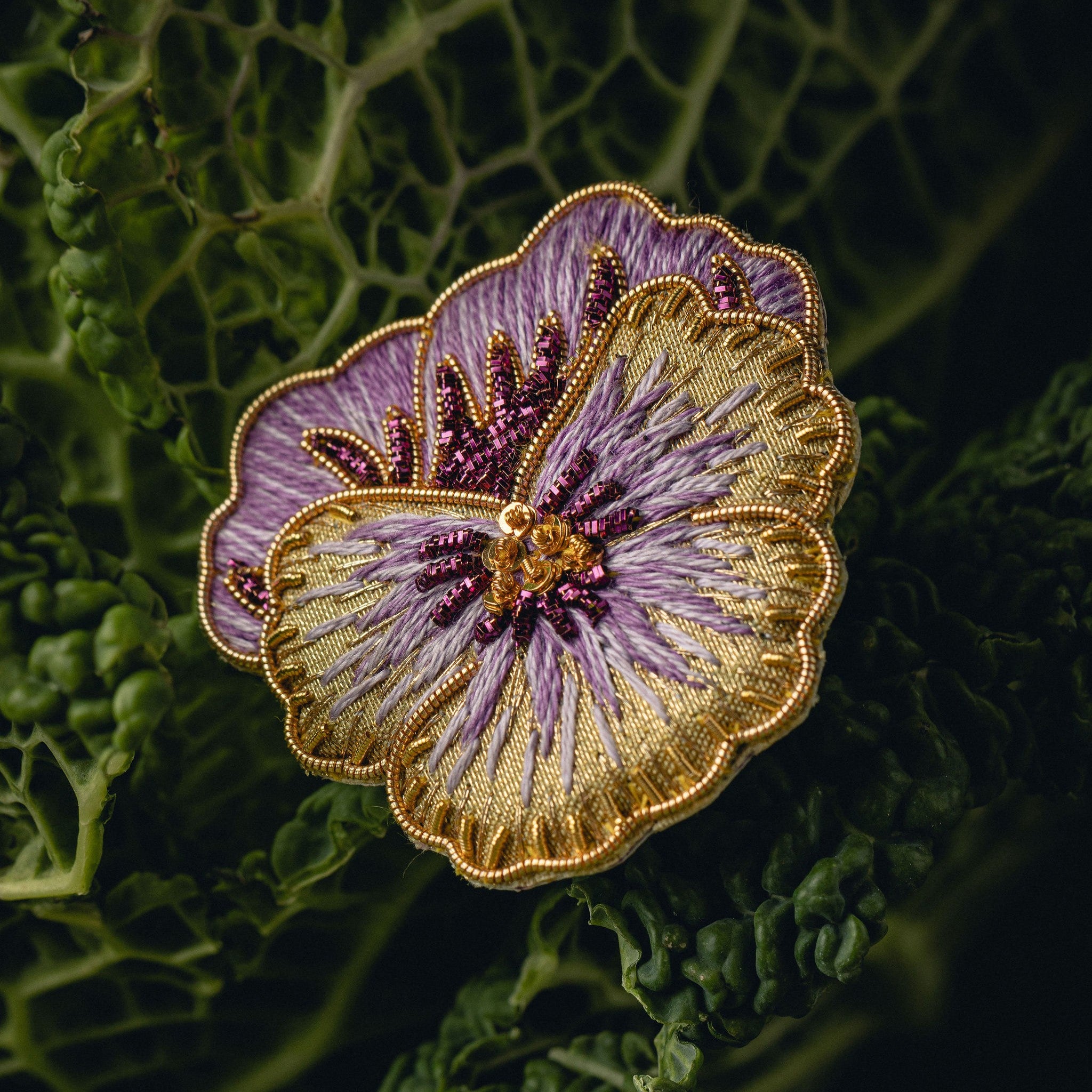 Pansy Brooch - Hand Embroidered flower brooch on a cabbage leaf background