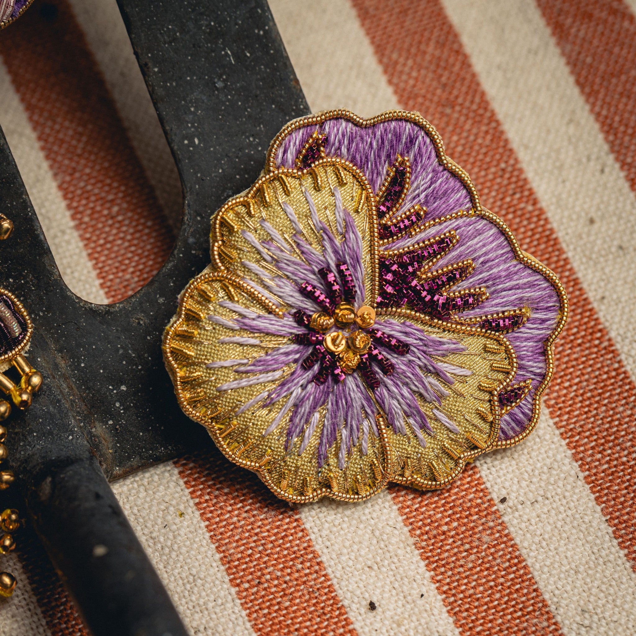 Pansy Brooch - Hand Embroidered brooch photographed on a striped background