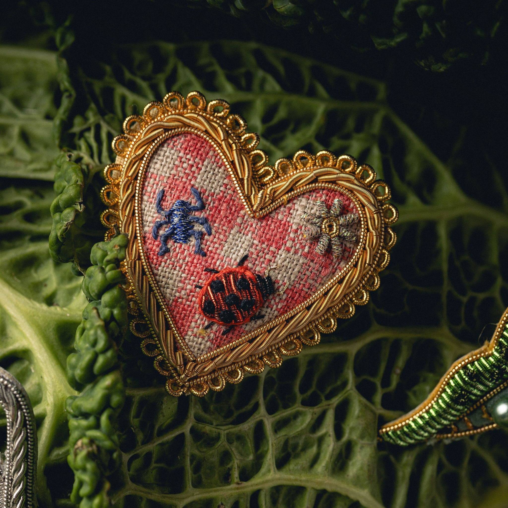 Picnic Heart Brooch - Hand Embroidered heart brooch photographed on a cabbage leaf