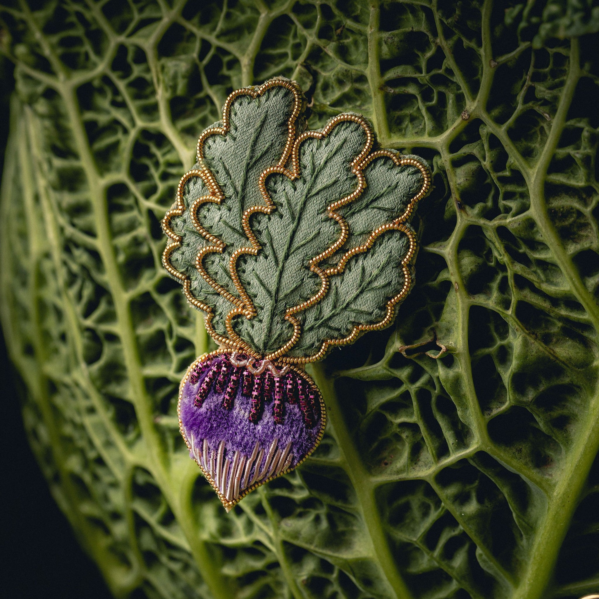 Radish Brooch - Brooch displayed on a cabbage leaf