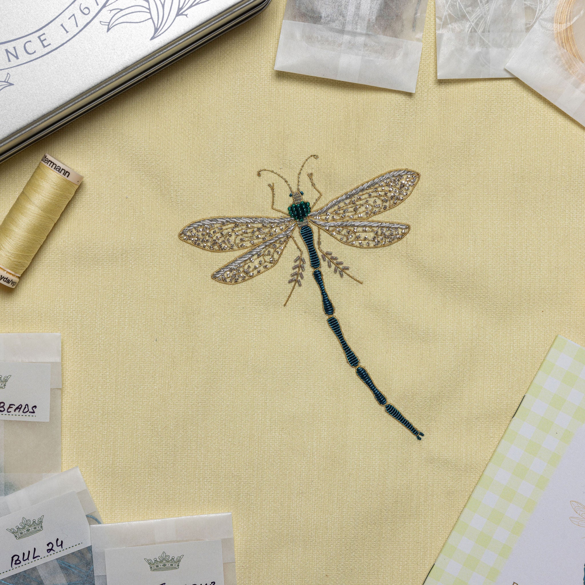 The Dragonfly Kit - Embroidered dragonfly design on butter yellow fabric 