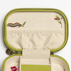 The Garden Embroidered Jewellery Box - Embroidered jewellery case interior lid with a caterpillar and flower embroideries on a beige background