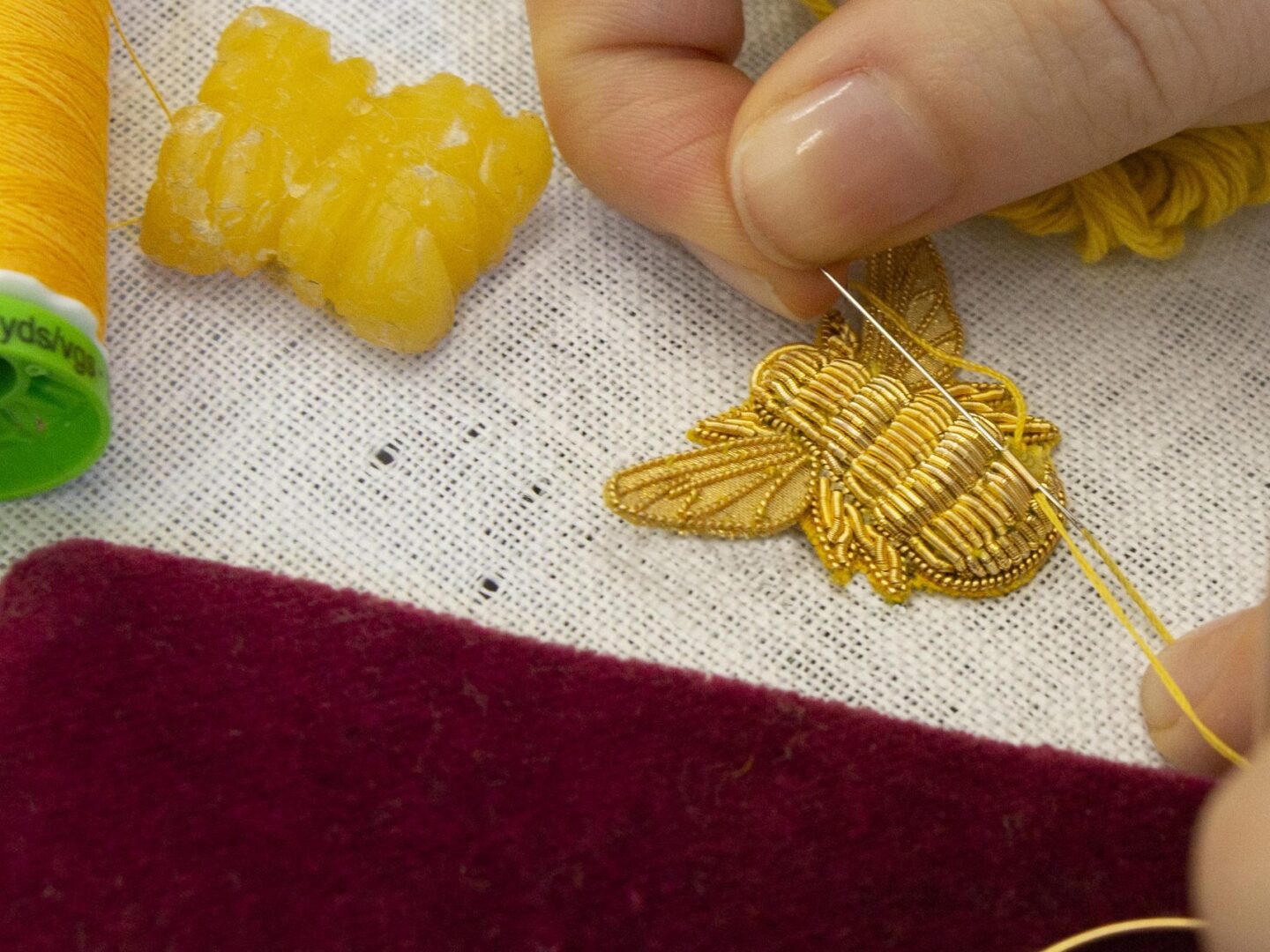 The making of a hand embroidered goldwork bee
