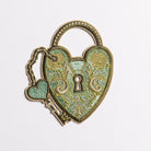 Verdigris Padlock Embroidered Patch - Decorative heart-shaped lock with key on a white background