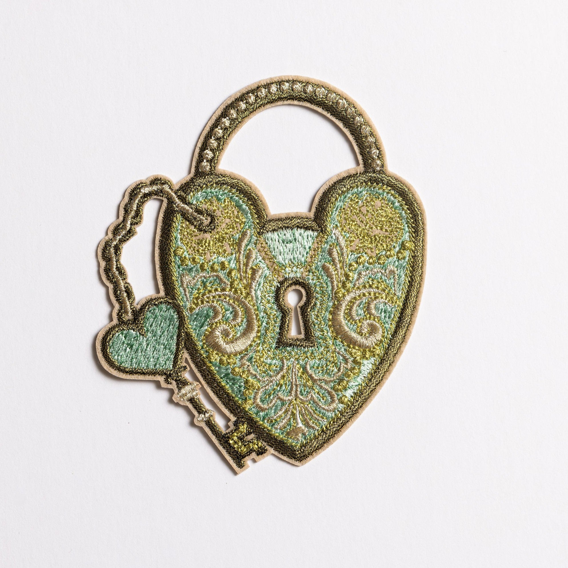 Verdigris Padlock Embroidered Patch - Decorative heart-shaped lock with key on a white background